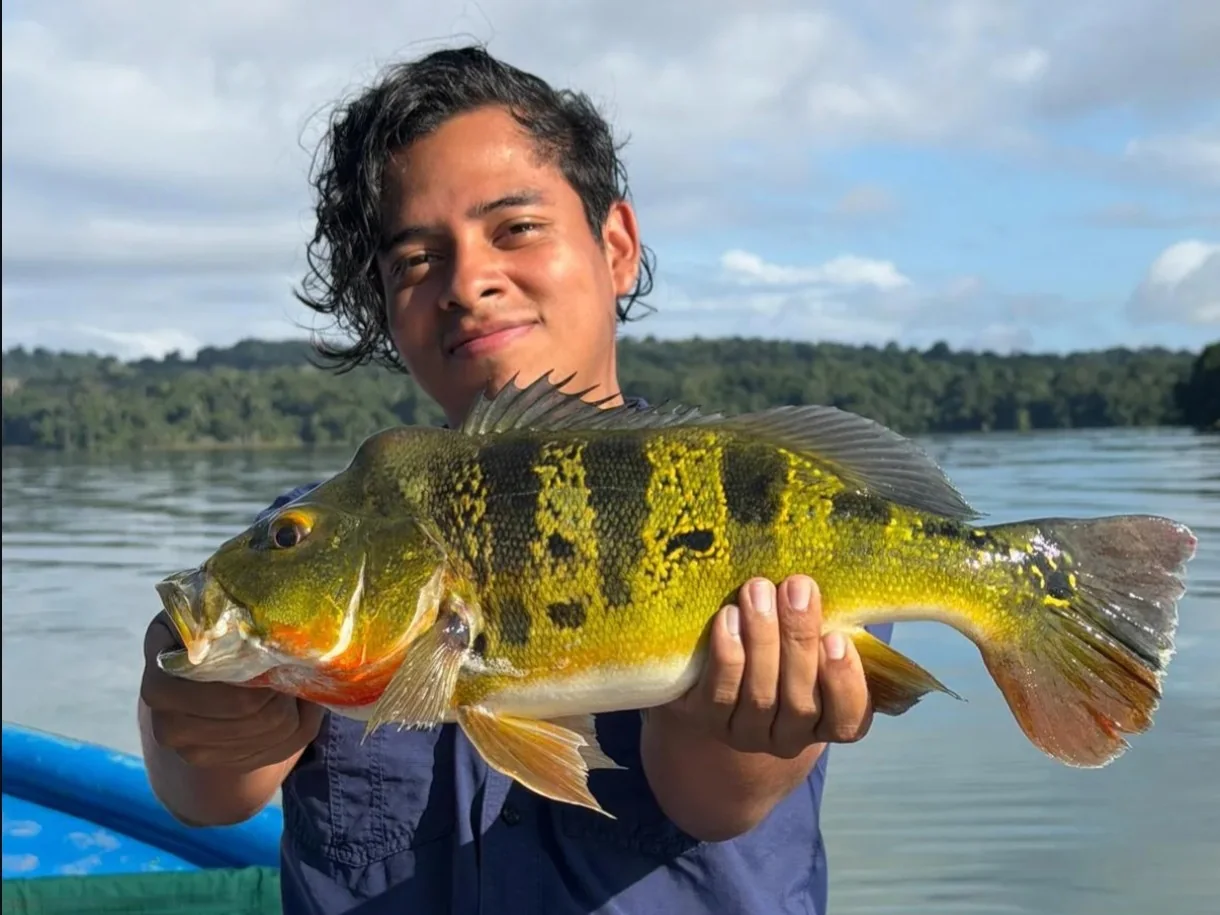 Angler holding a sargento fish on a fishing outing