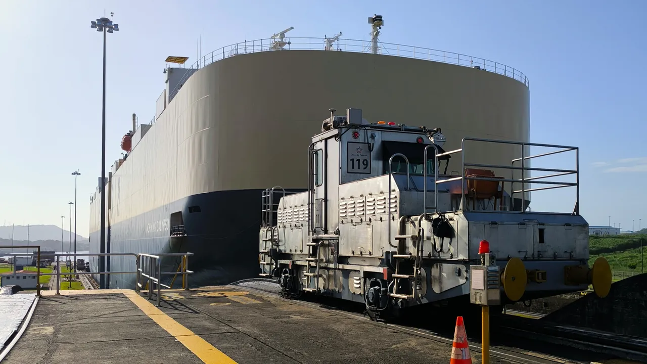 Ship and towing locomotive at the Panama Canal